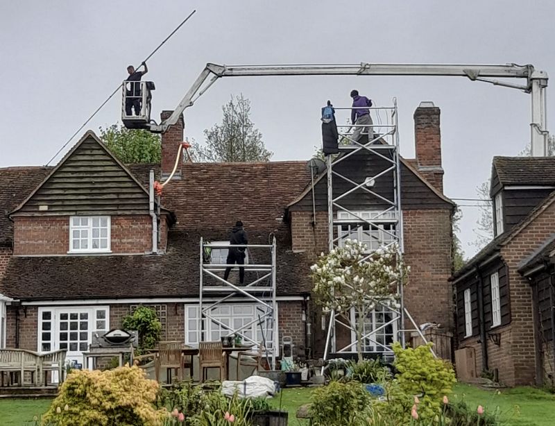 The Moss Cleaners using cherry picker and scaffolding to clean roof safely and professionally in Highworth, Wiltshire